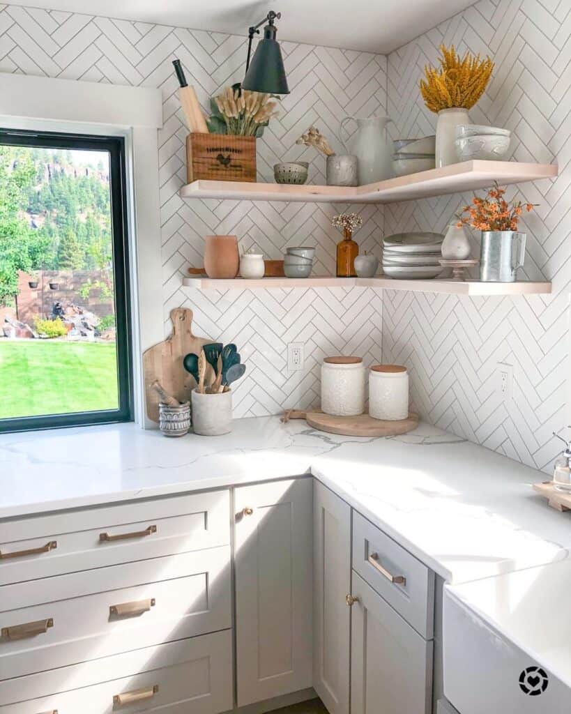 Brass Hardware on Light Gray Kitchen Cabinets