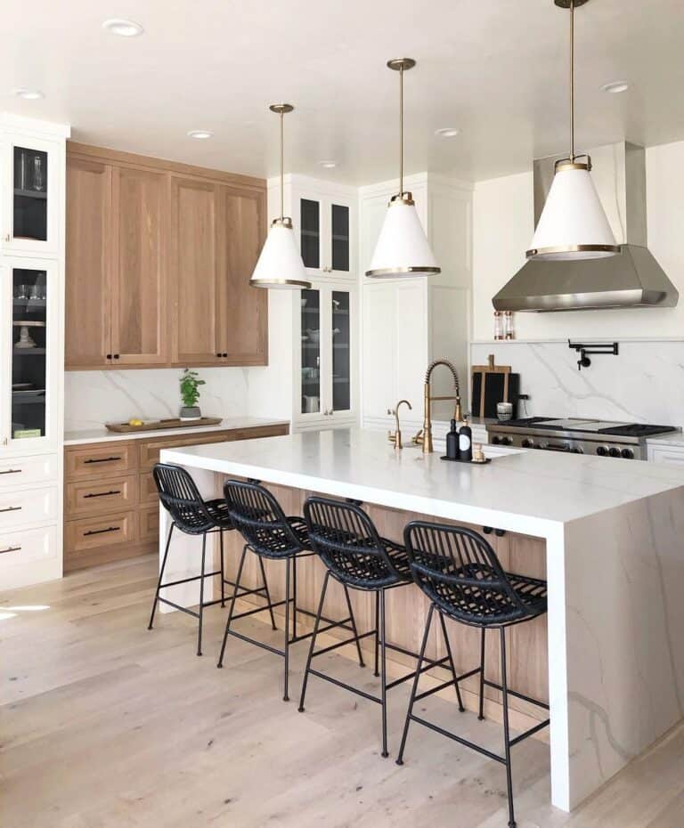 Black Bar Stools with a Back Under a White Counter