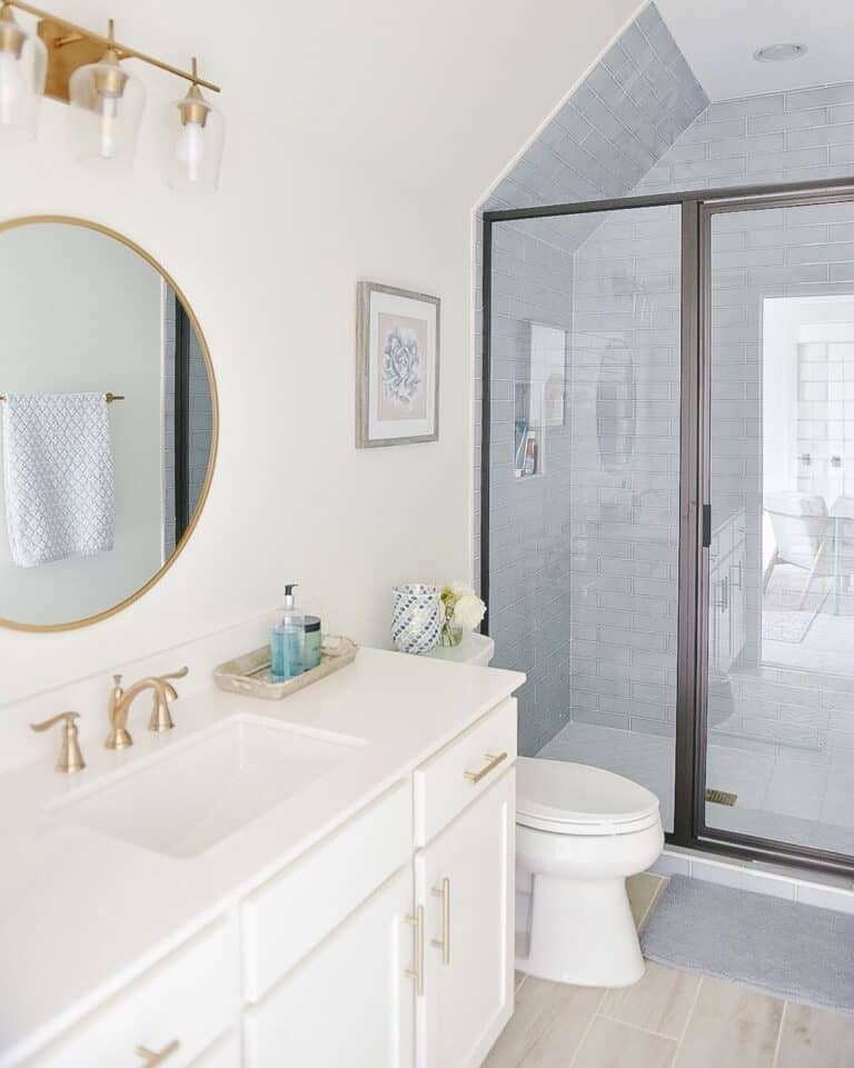 Gray Tile Shower with Black and Glass Enclosure