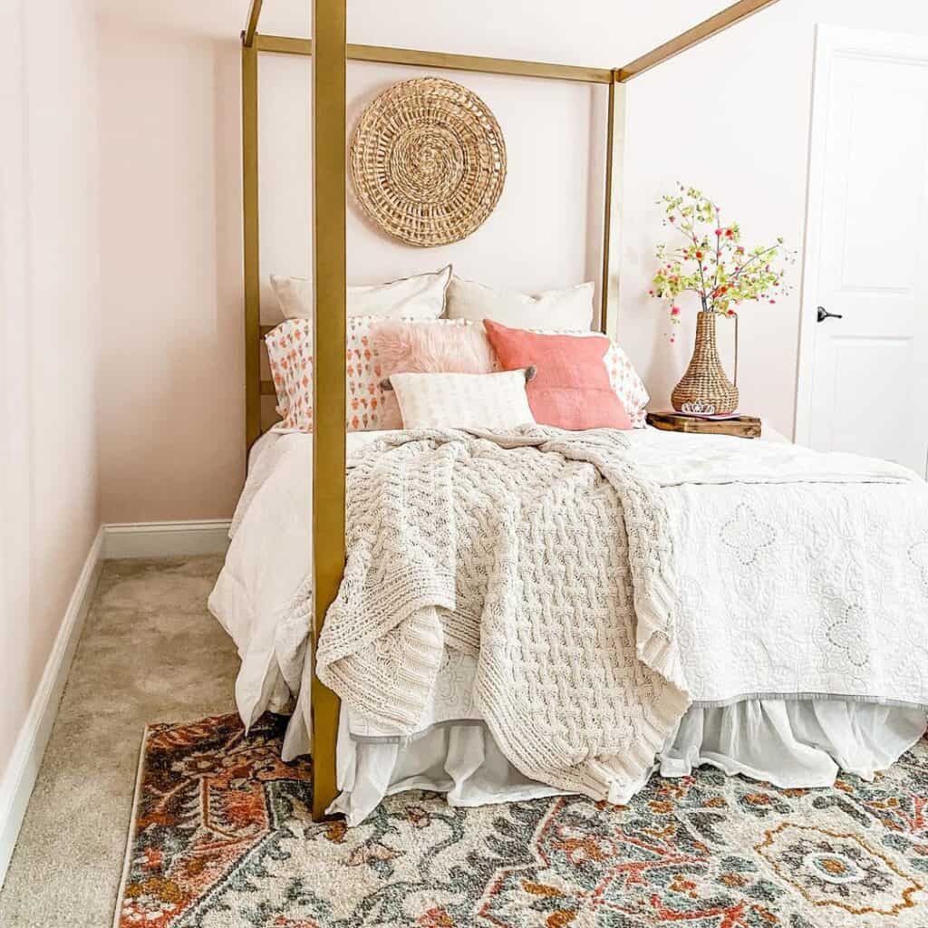 Gold Canopy Bed Frame in Pink Bedroom