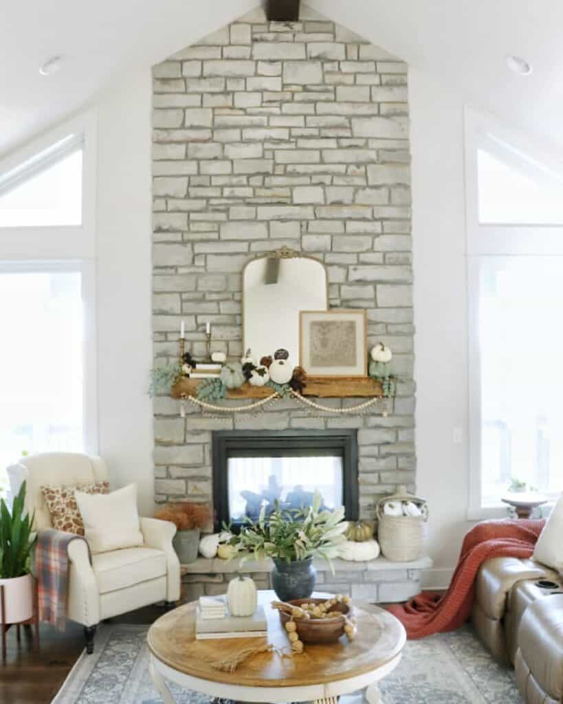 Gray Floor to Ceiling Stone Living Room Fireplace