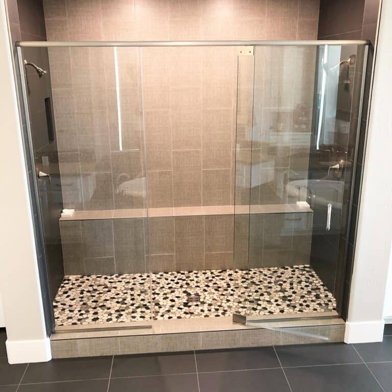 Gray Vertical Tile Shower with Glass Door