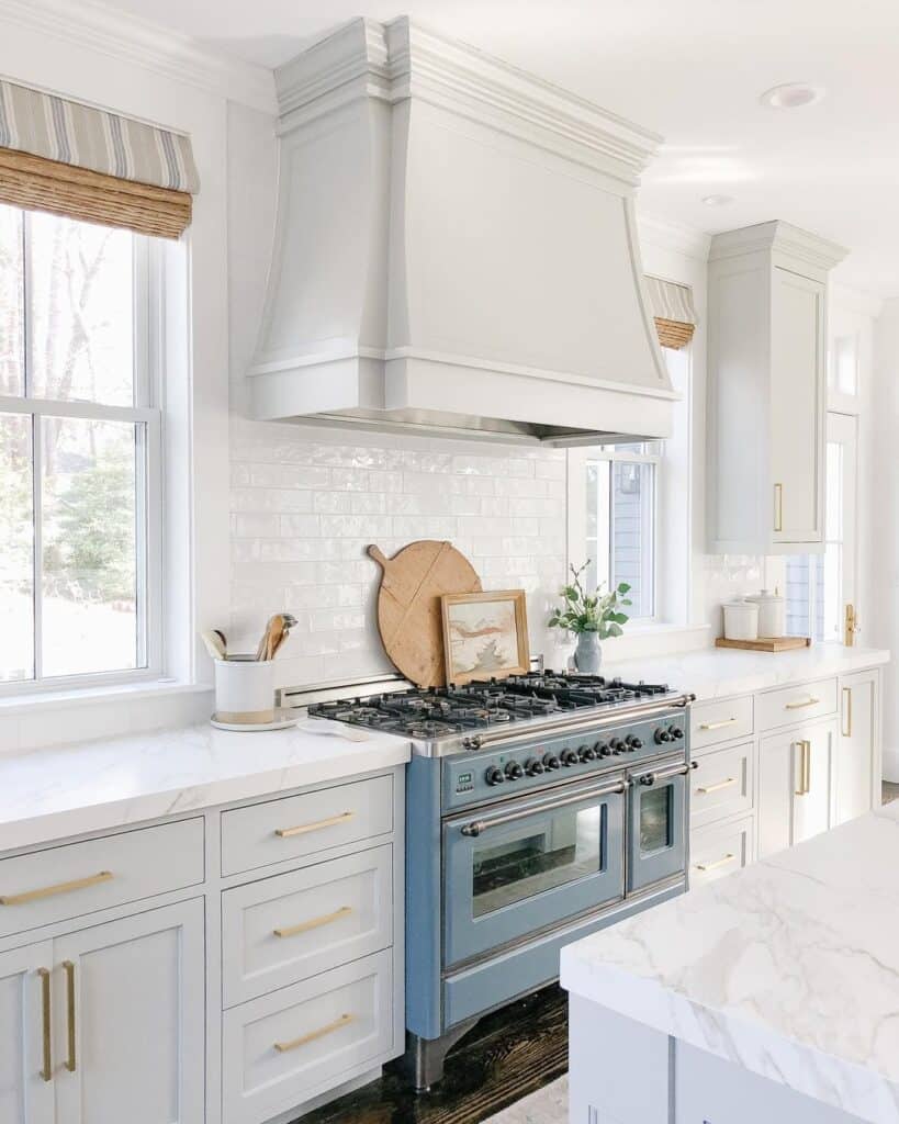 Light Gray Kitchen Cabinets with Gold Pulls