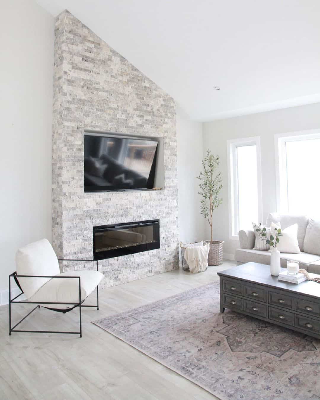 Slanted Ceiling Living Room With Brick Fireplace Soul & Lane