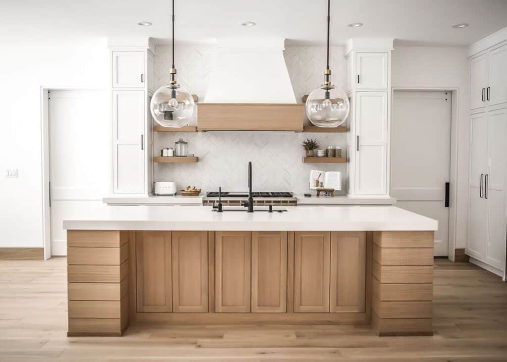 White Kitchen Cabinets with Herringbone Backsplash