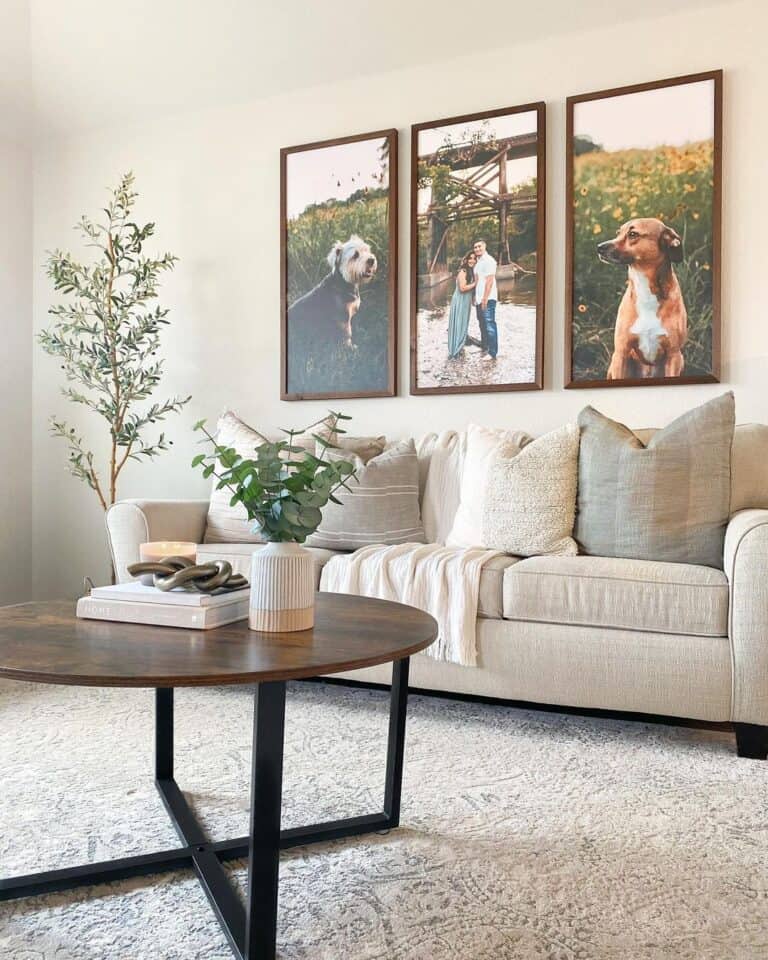 Wood Frame Photographs Above a Beige Couch