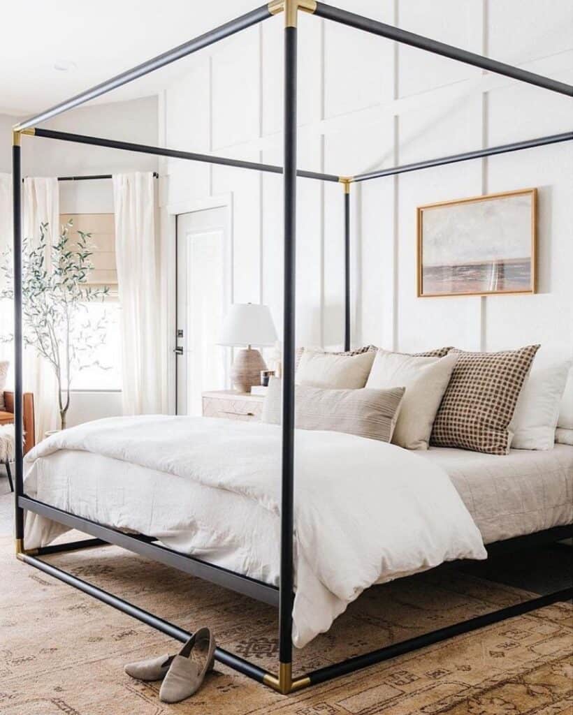 Bedroom with Black and Brass Bed Canopy