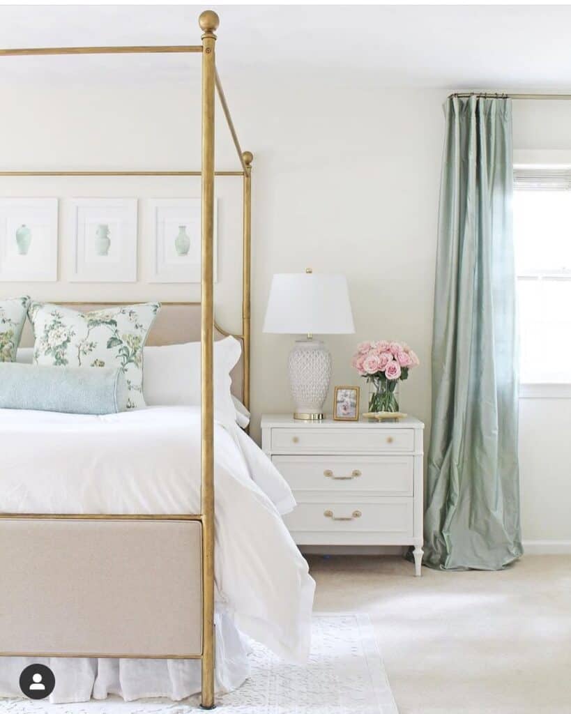 Beige and Brass Canopy Bed with White Nightstand