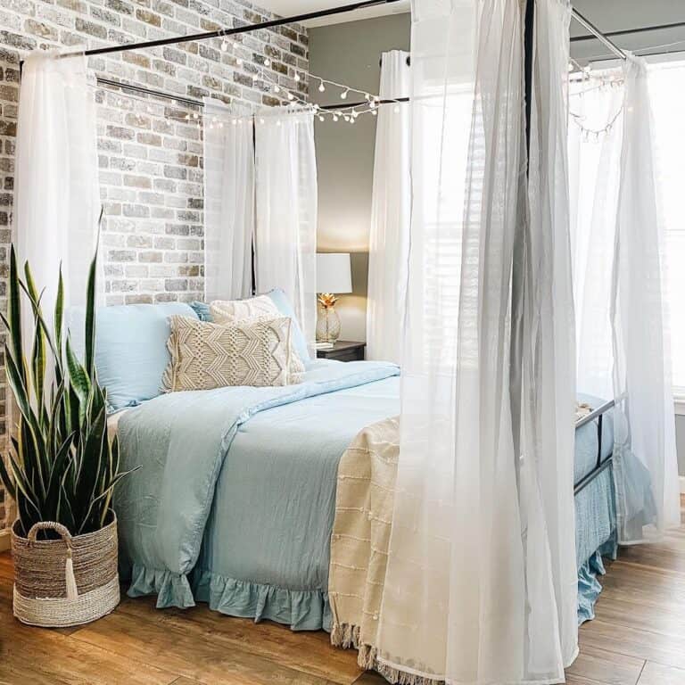 Black Bed Canopy with Sheer White Curtains
