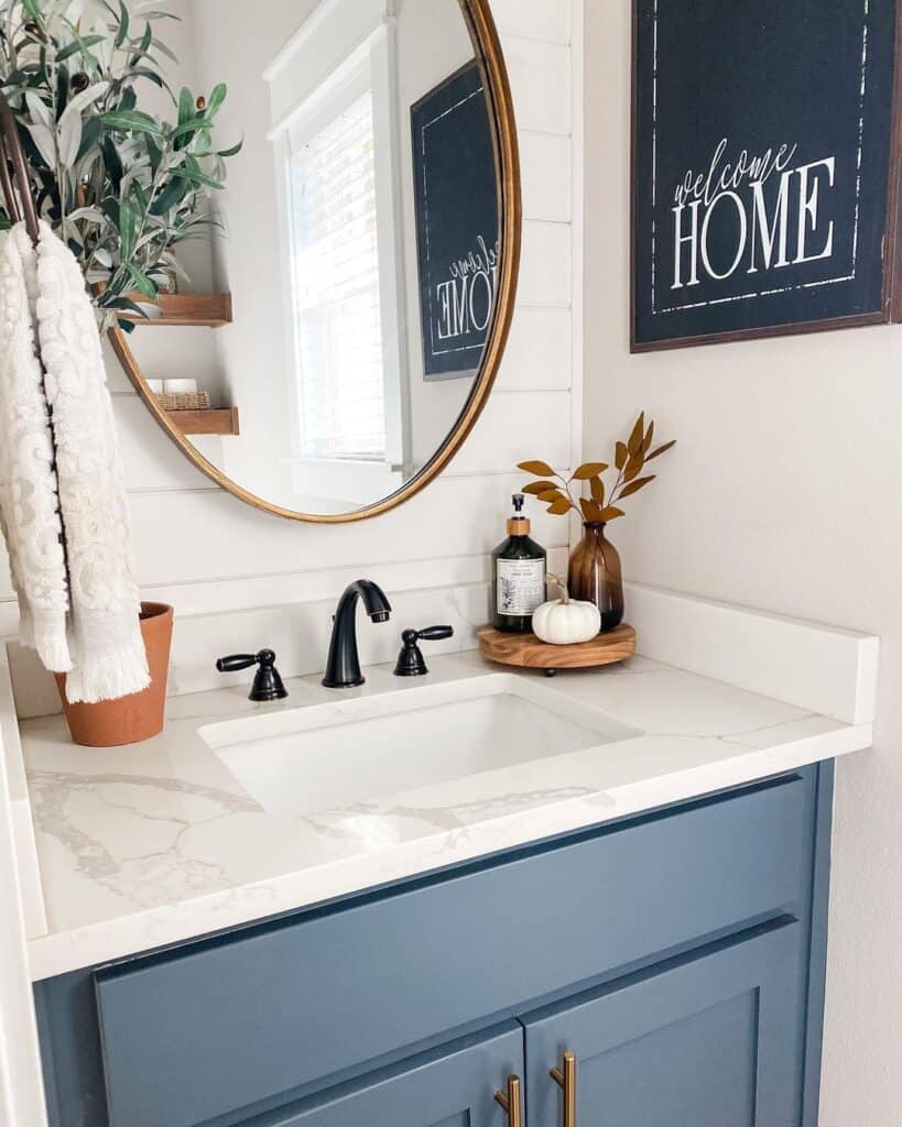 Blue Washstand with Brass Oval Bathroom Mirror
