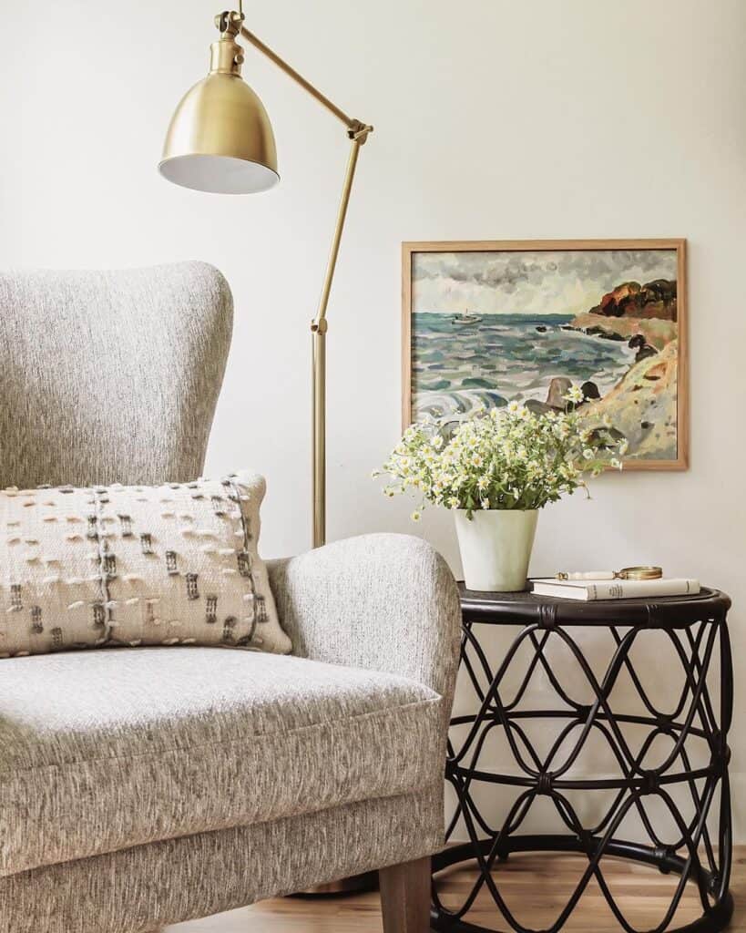 Gray Armchair with Tall Gold Lamp
