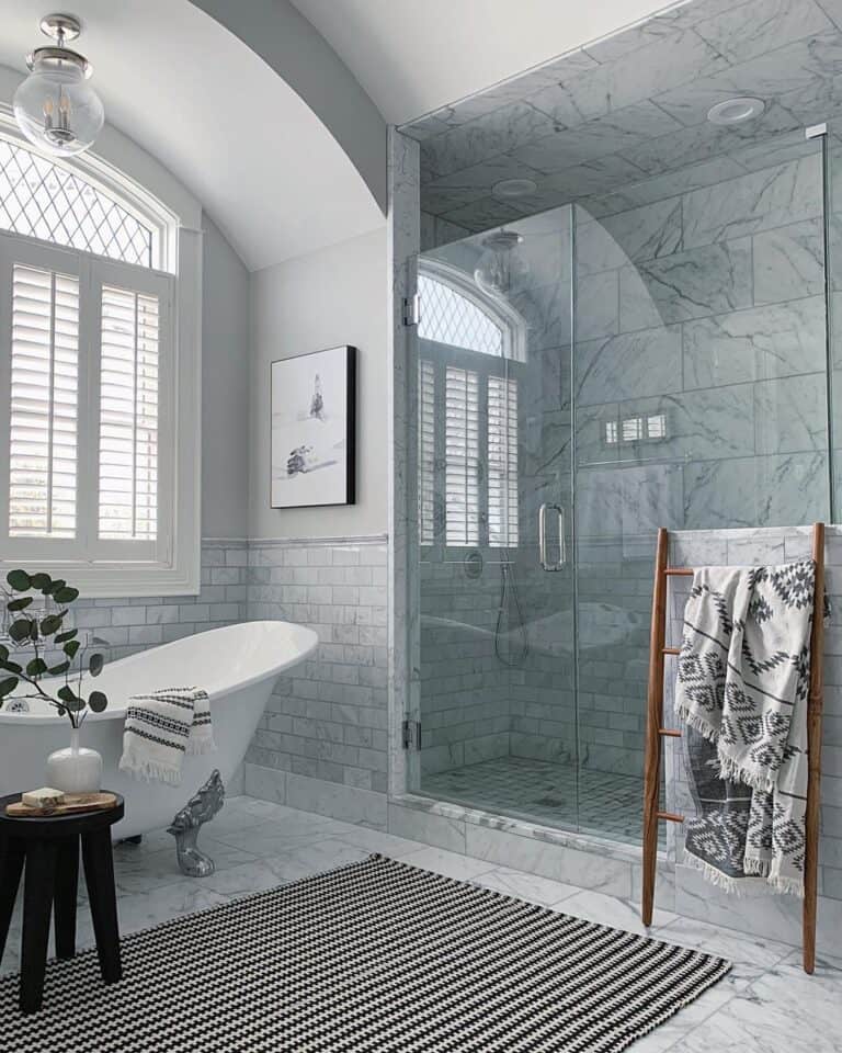 Gray Marble Tile Shower with Glass Enclosure
