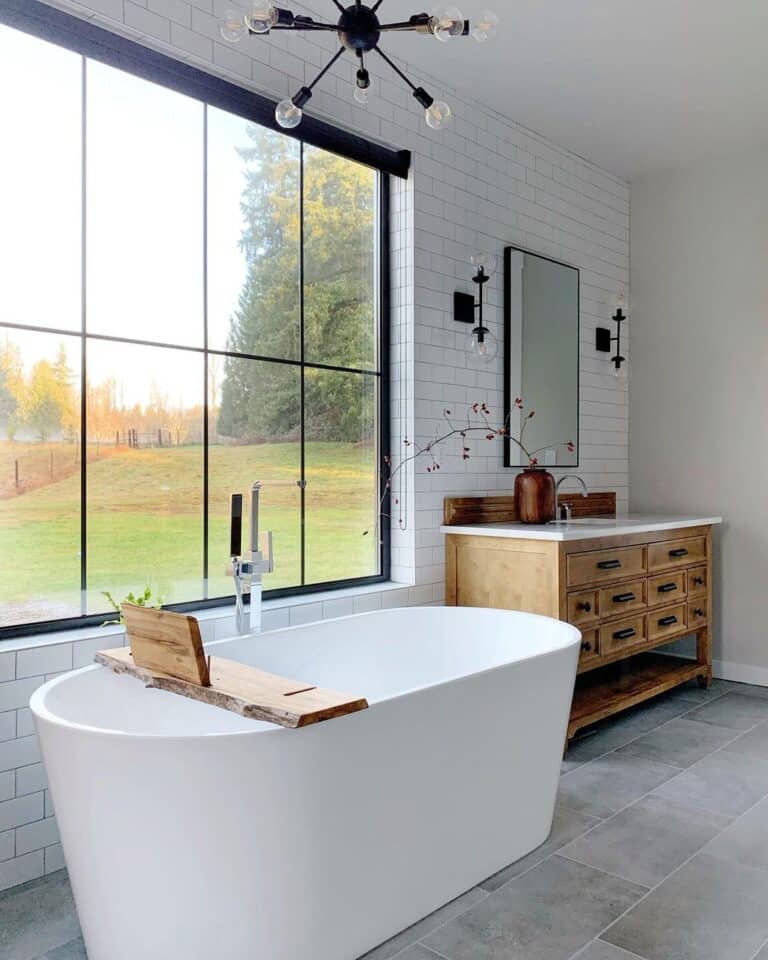 White Freestanding Bathtub on Gray Tile Flooring