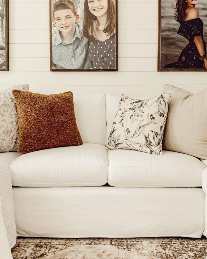 White Slipcovered Couch with Accent Pillows