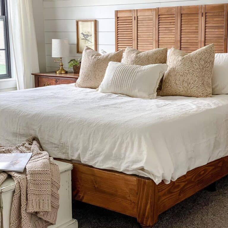 White and Gold Lamp on Stained Wood Nightstand