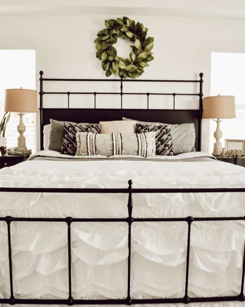 Black Metal Bed with White Ruffled Bedding