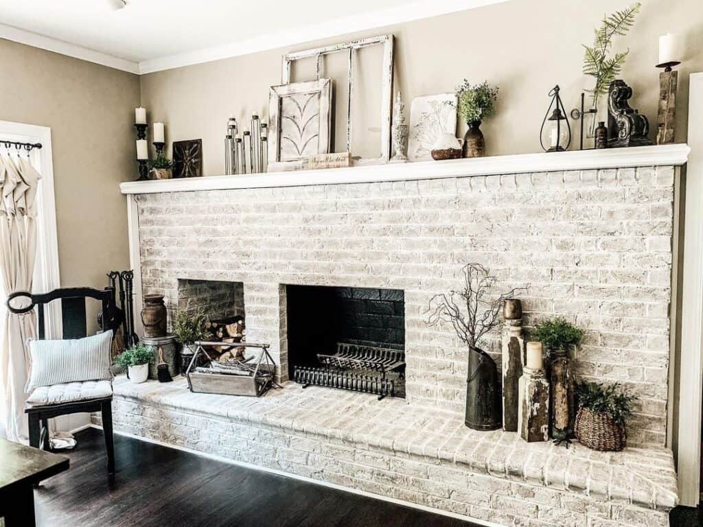 Gray Whitewash Brick Fireplace with White Mantel