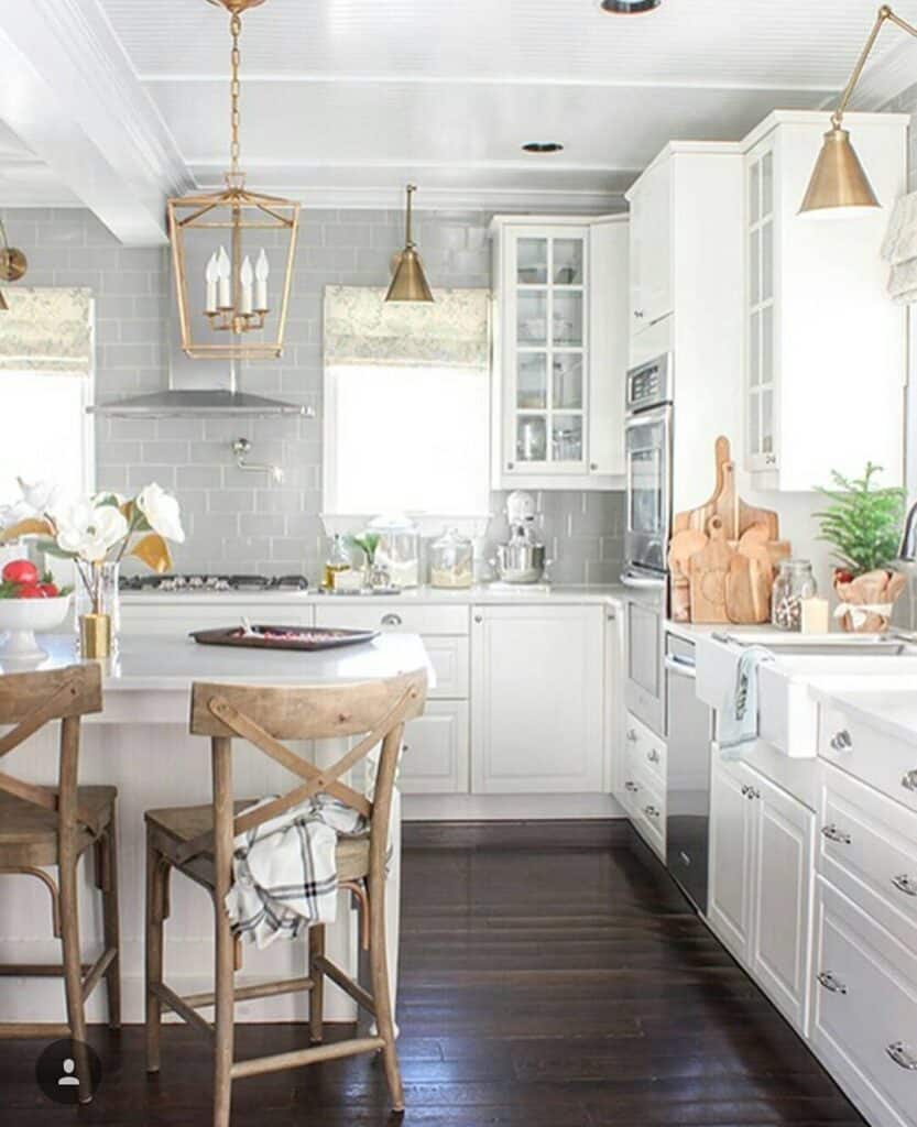 White Kitchen with Dark Wood Flooring