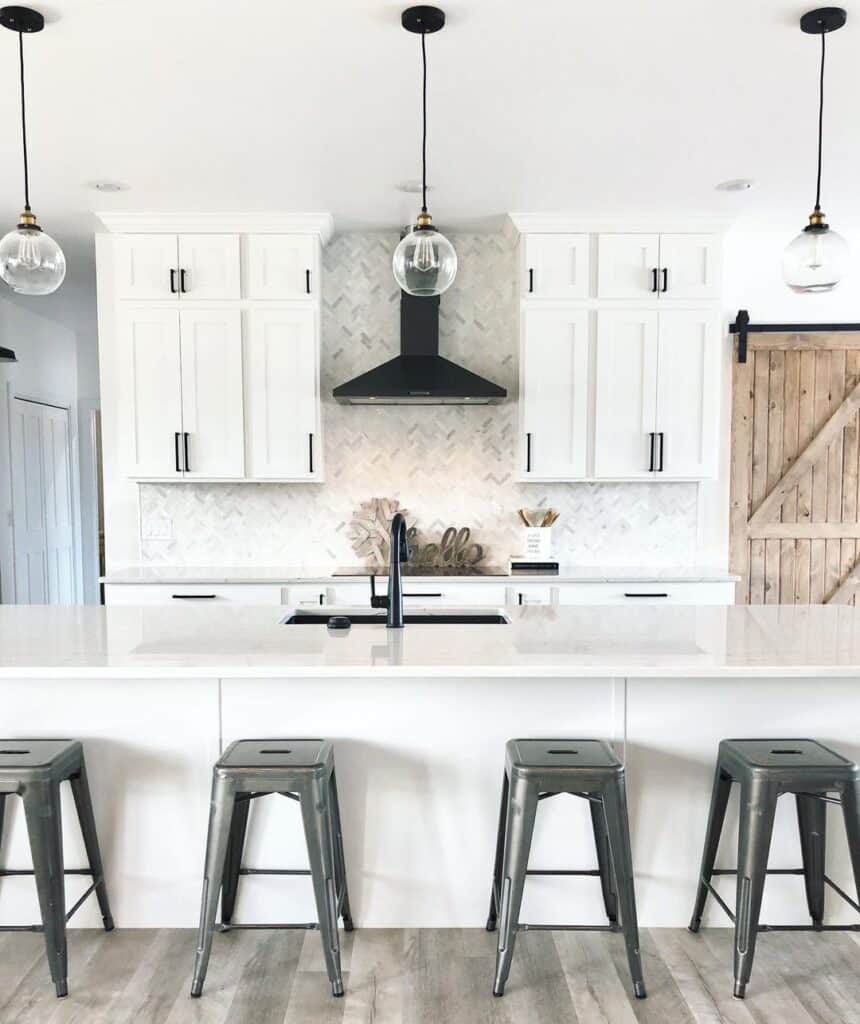 White Kitchen with Herringbone Tile Backsplash