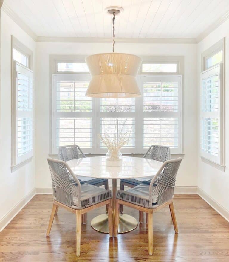 White and Brass Pedestal Dining Table