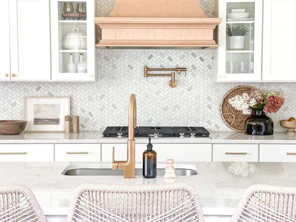 White and Gray Herringbone Tile Backsplash