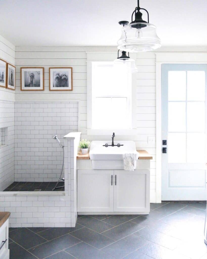 Black Herringbone Tile Bathroom With Farmhouse Shower