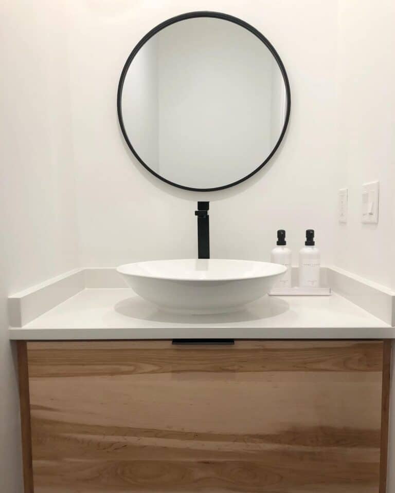 Half Bath with Black Frame Round Mirror