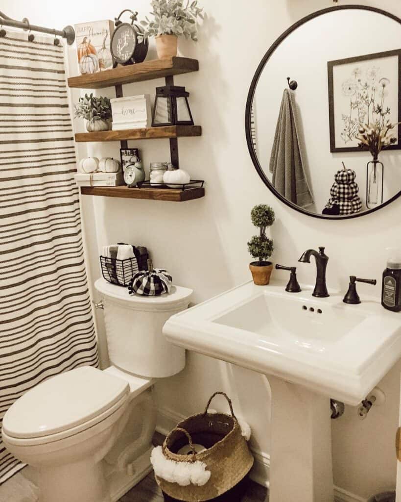 Pedestal Sink with Black Round Bathroom Mirror