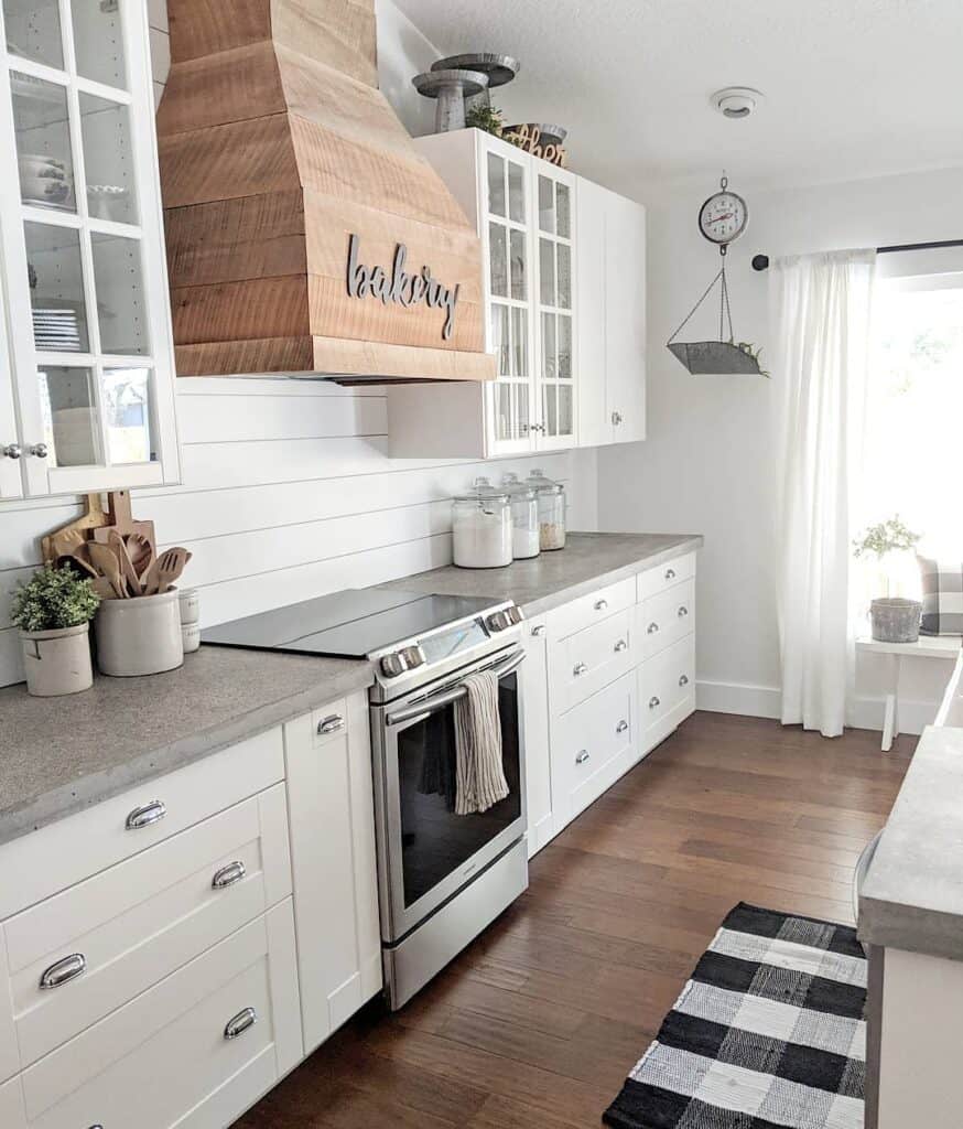 Shiplap Kitchen Wall with White Cabinets