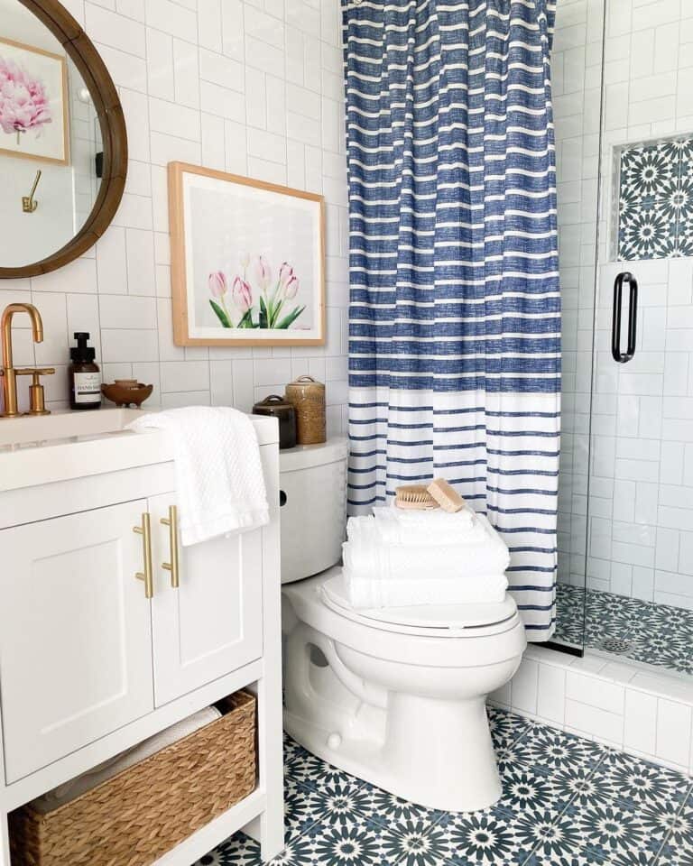 Blue Bathroom Decor with Tile Floor and Shower Niche