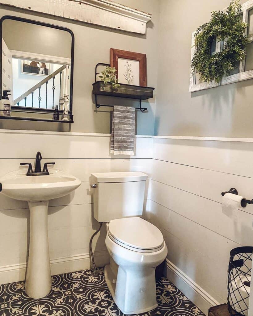 Black Bathroom Tile with an Ornate White Pattern