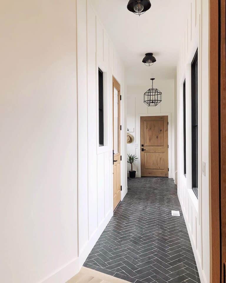 Black Herringbone Tile in a Long Hallway