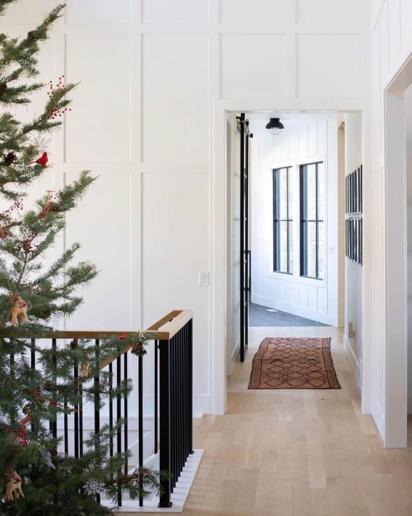 Bright Open Hallway with Black Metal Railing