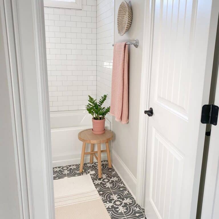 Dark Patterned Tile Paired with a Sculpted Baseboard