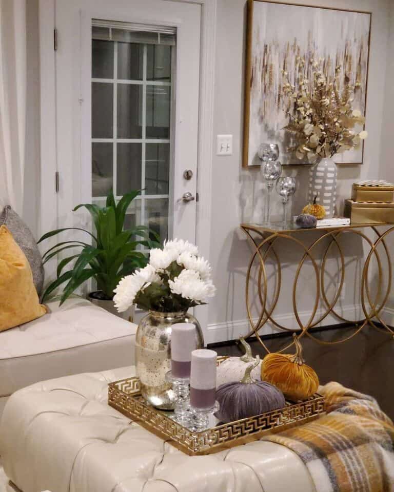 Fall Decorations on a Cushioned Ottoman