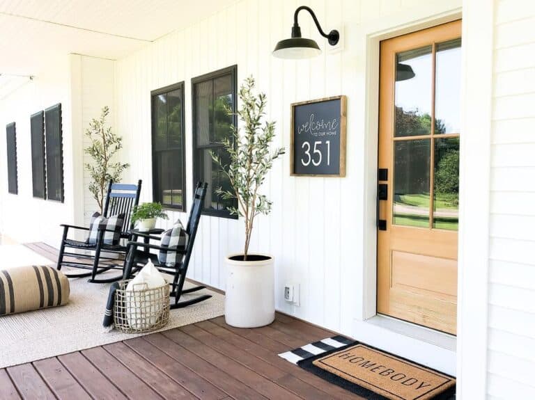 Front Door With Glass Panels on Large Porch