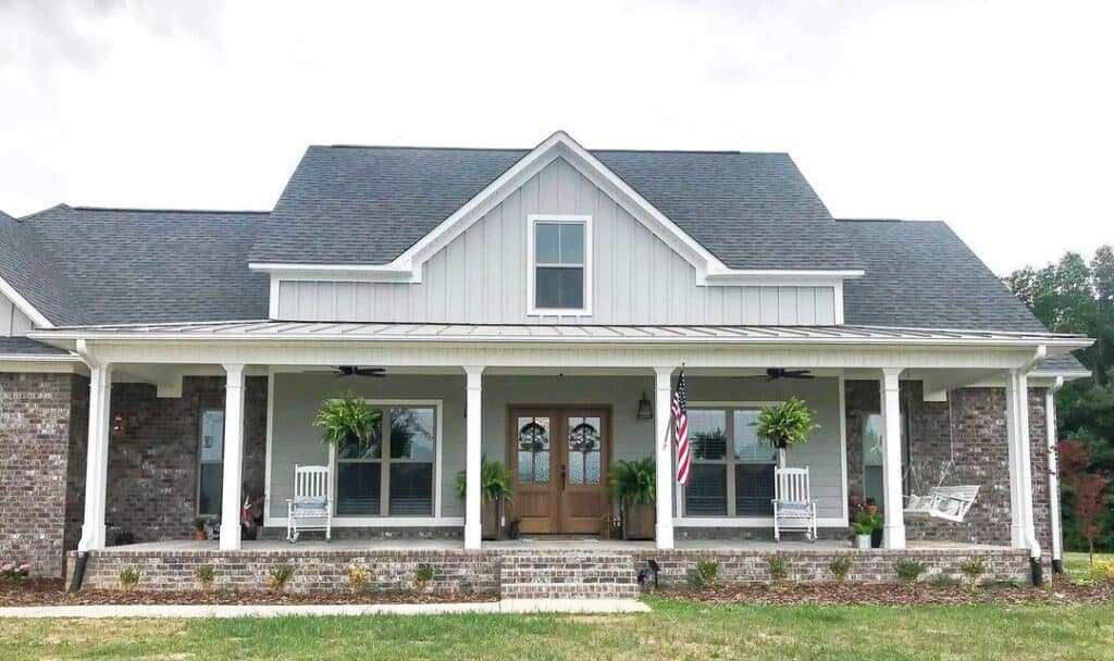 Gray House with White Covered Porch Posts