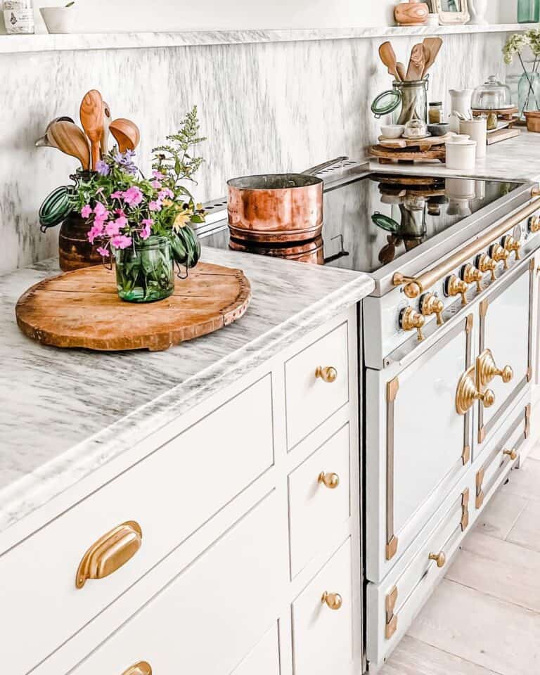 Grey Marble Countertop with Gold Knobs and Pulls