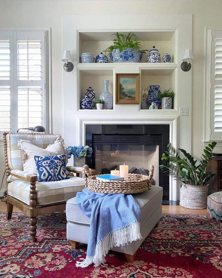 Grey Ottoman In Front of Fireplace