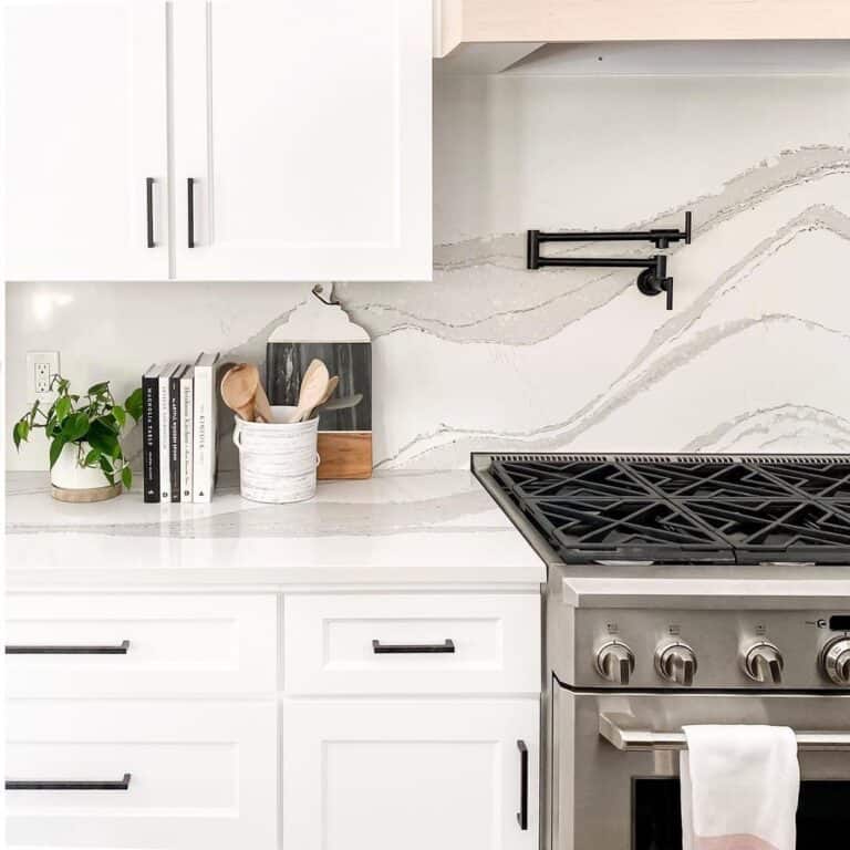 Kitchen With Black Pot Filler Above Stove