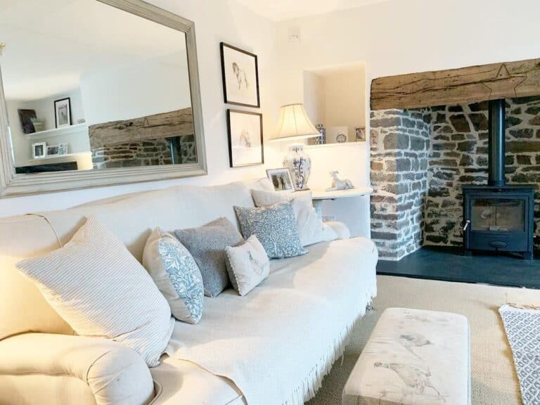 Large Rectangular Mirror Over White Couch