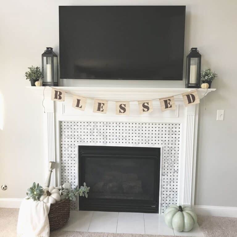 Large TV Over a White Fireplace