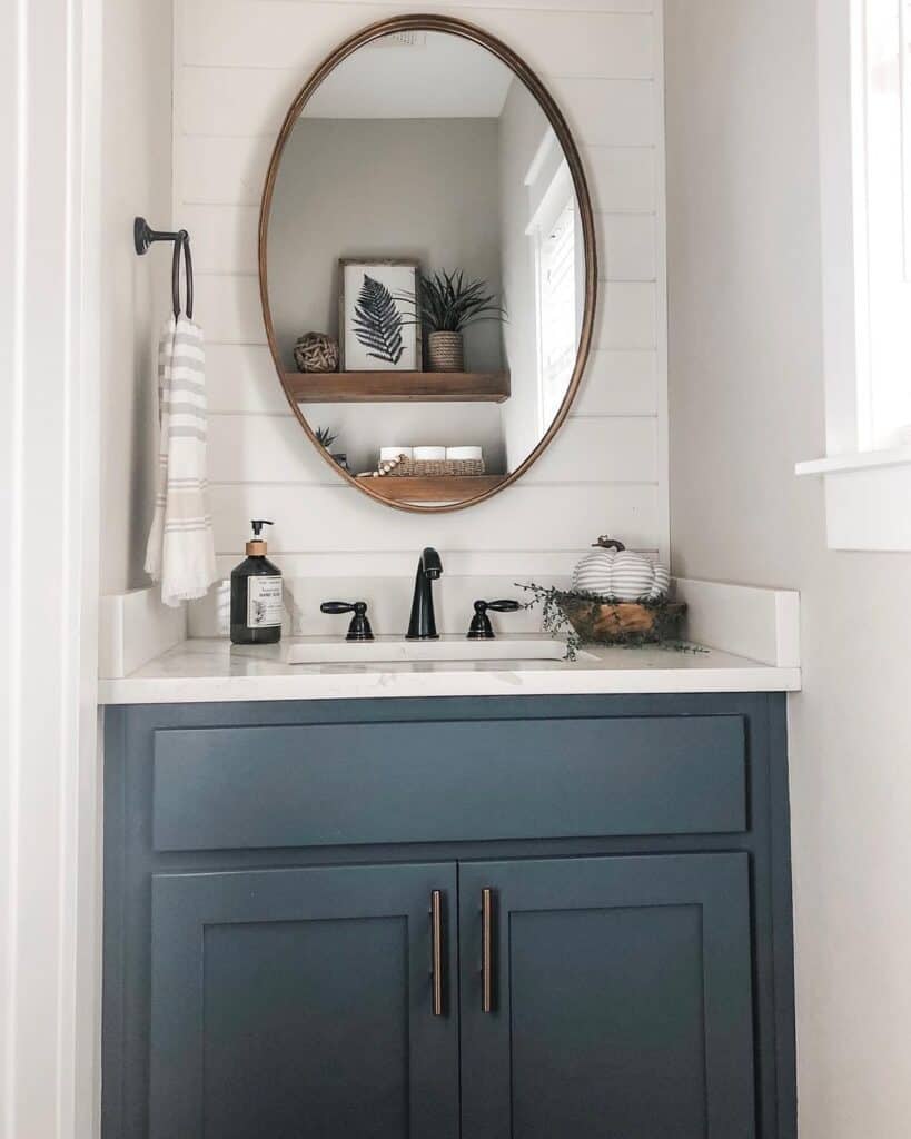 Navy Powder Room Vanity with Oval Mirror