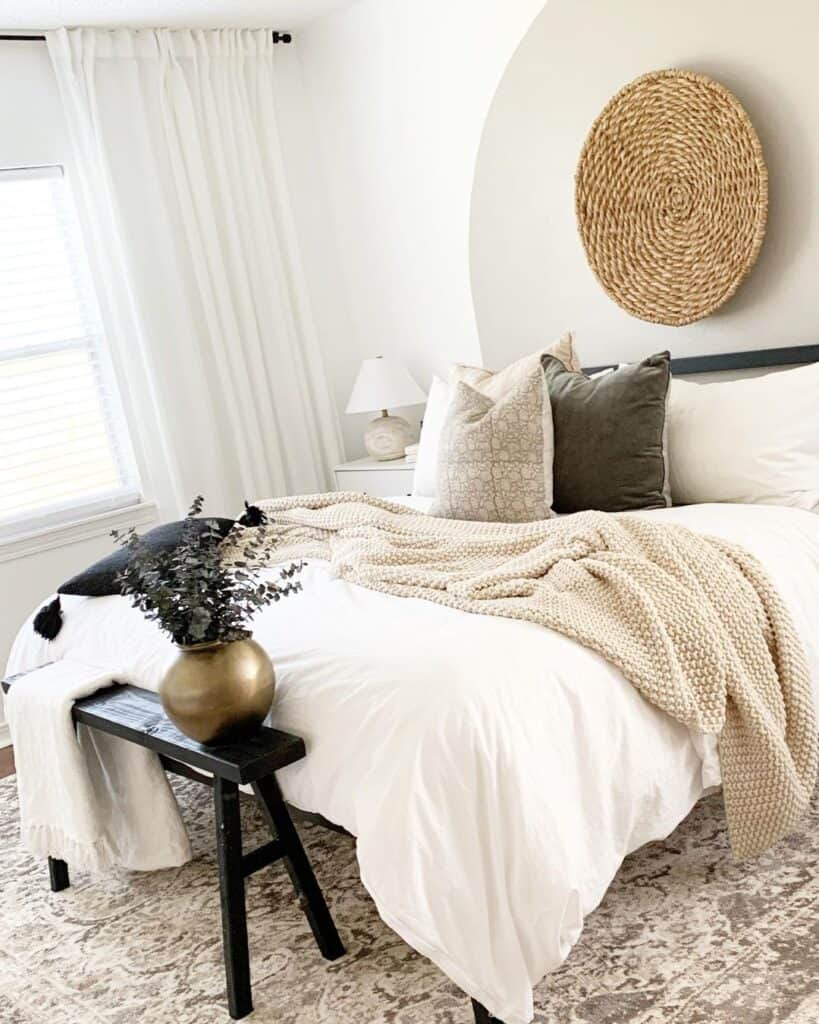 Neutral Bedding With Throw Blankets and Bench