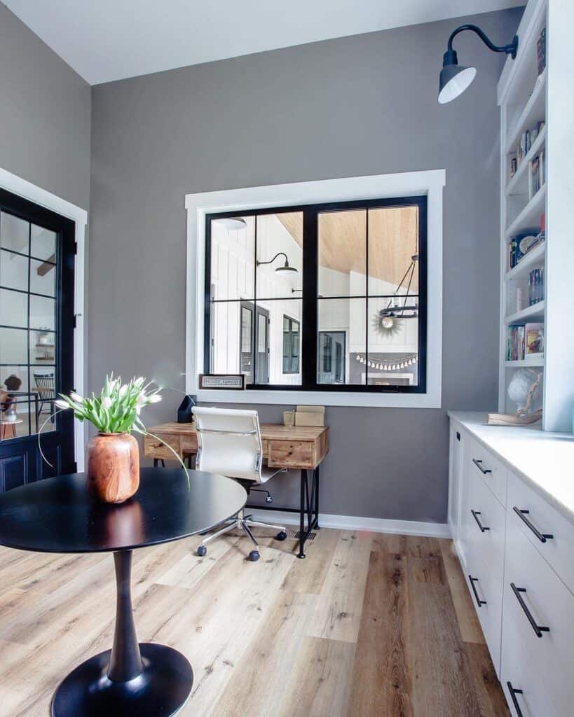 Office with White Baseboard and Oak Floors