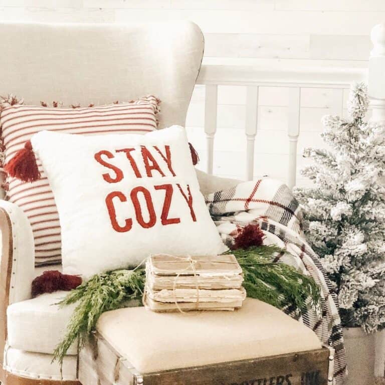 Plaid Christmas Throw Nestled in White Armchair