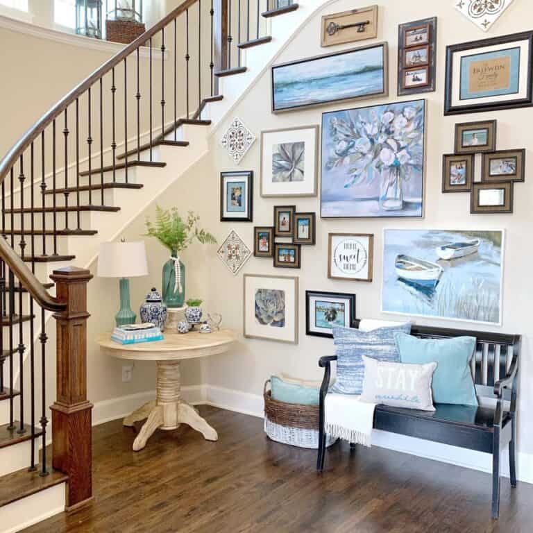 Round Light Wood Entryway Table Under a Staircase