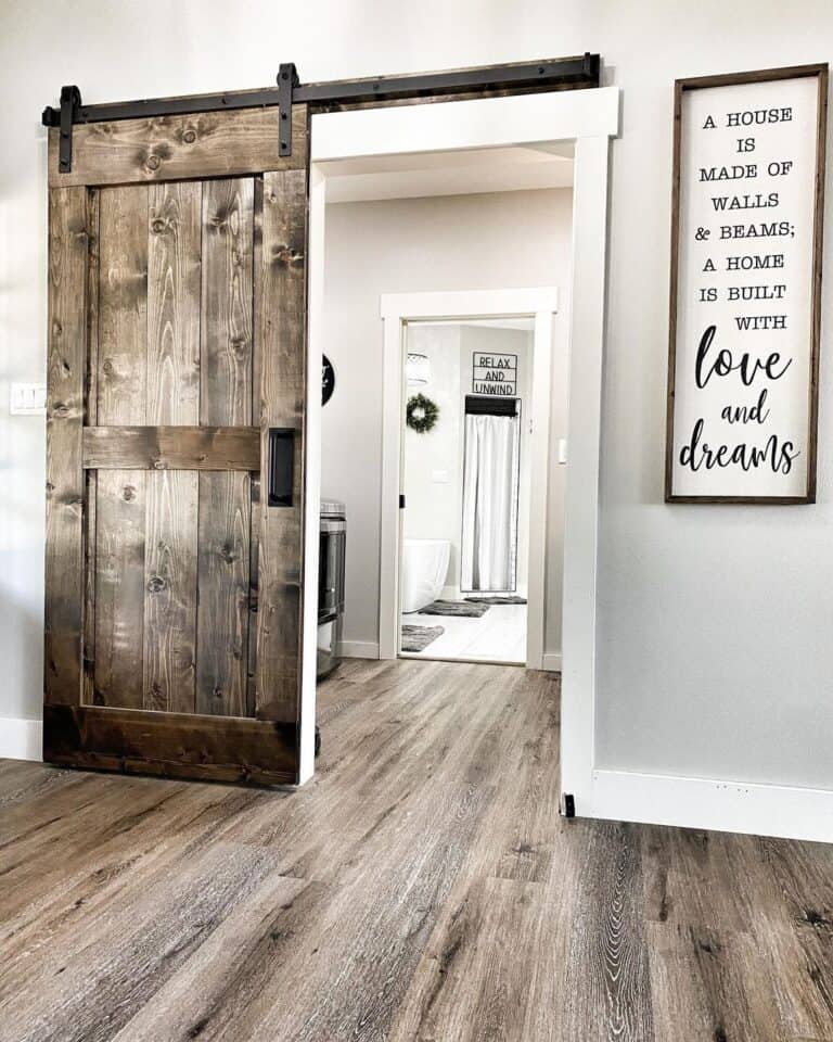 Rustic Laundry Room With Sliding Barn Door