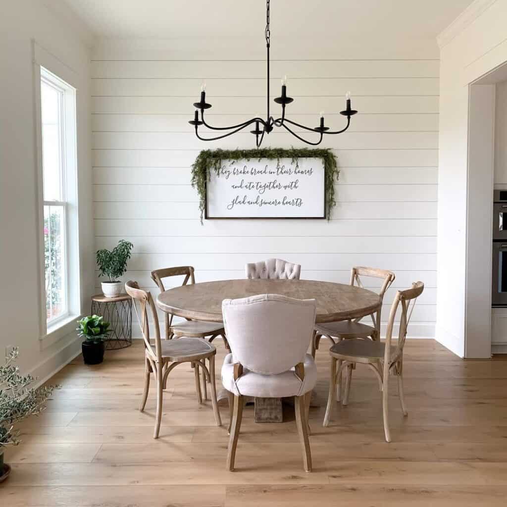 Shiplap Dining Room with White Baseboard and Oak Floors