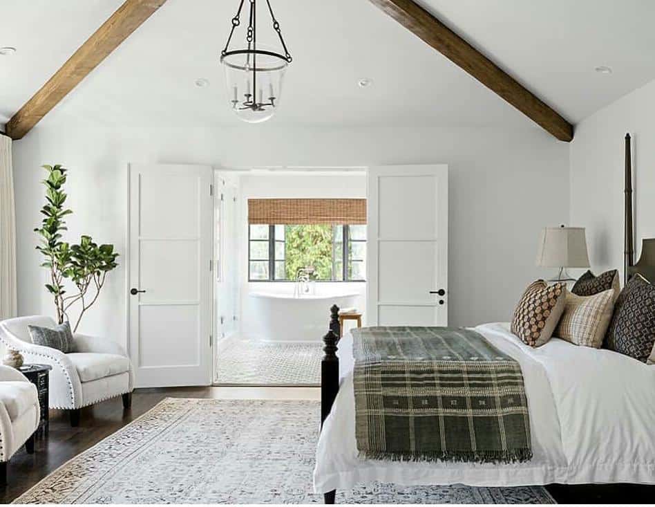 Sloped Ceiling Bedroom with Wood Beams